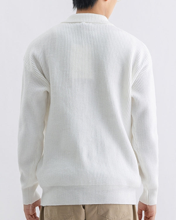 Stretchy knit sweater with high neck and buttons